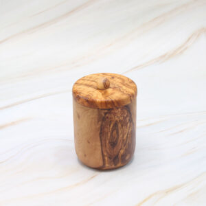 Handmade olive wood jar with lid and natural Mediterranean grain