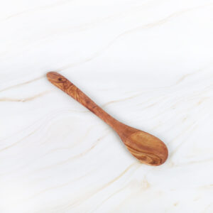 Handmade olive wood cooking spoon with natural Mediterranean grain