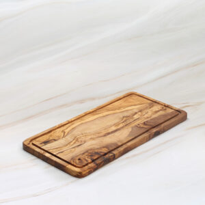 Handmade olive wood cutting board with groove and natural grain