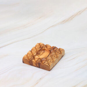 Checkered ravioli mold made from olive wood