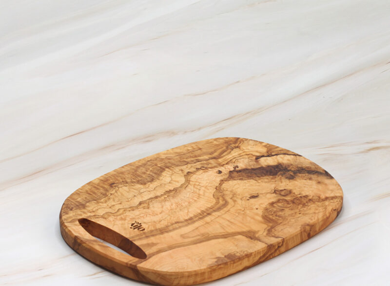 Home 13 Handcrafted olive wood oval cutting board with natural grain